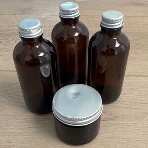 Set of Brown Glass Bottles with Silver Lids